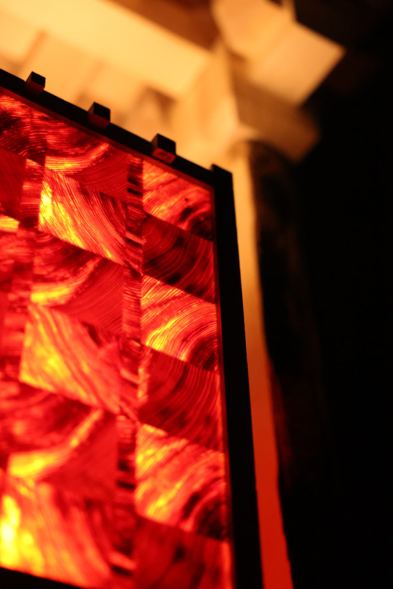 PASSAGE glowing end-grain panel held within a precise dark frame