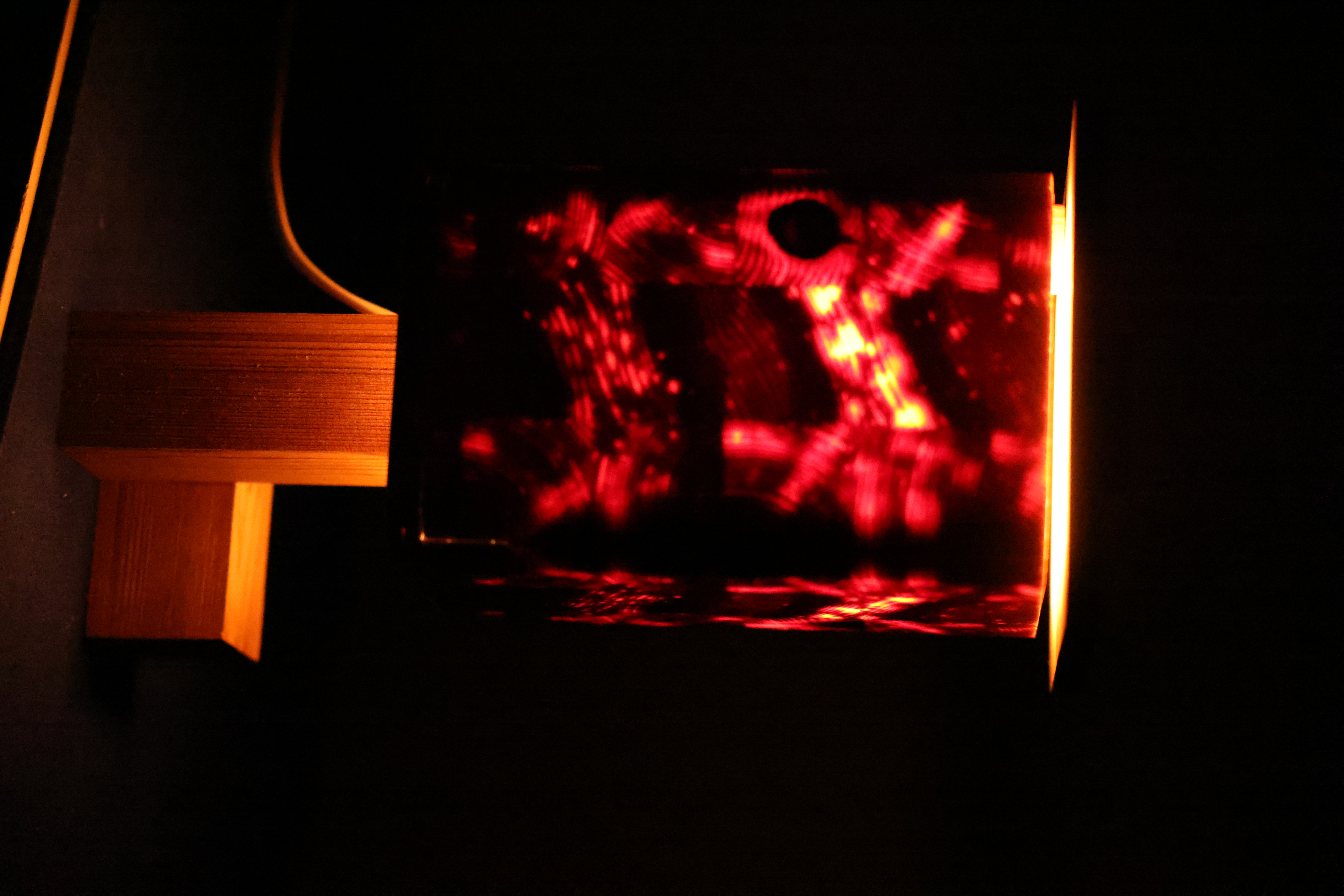 SEED detail — joinery and glowing resin panel of the wooden lamp