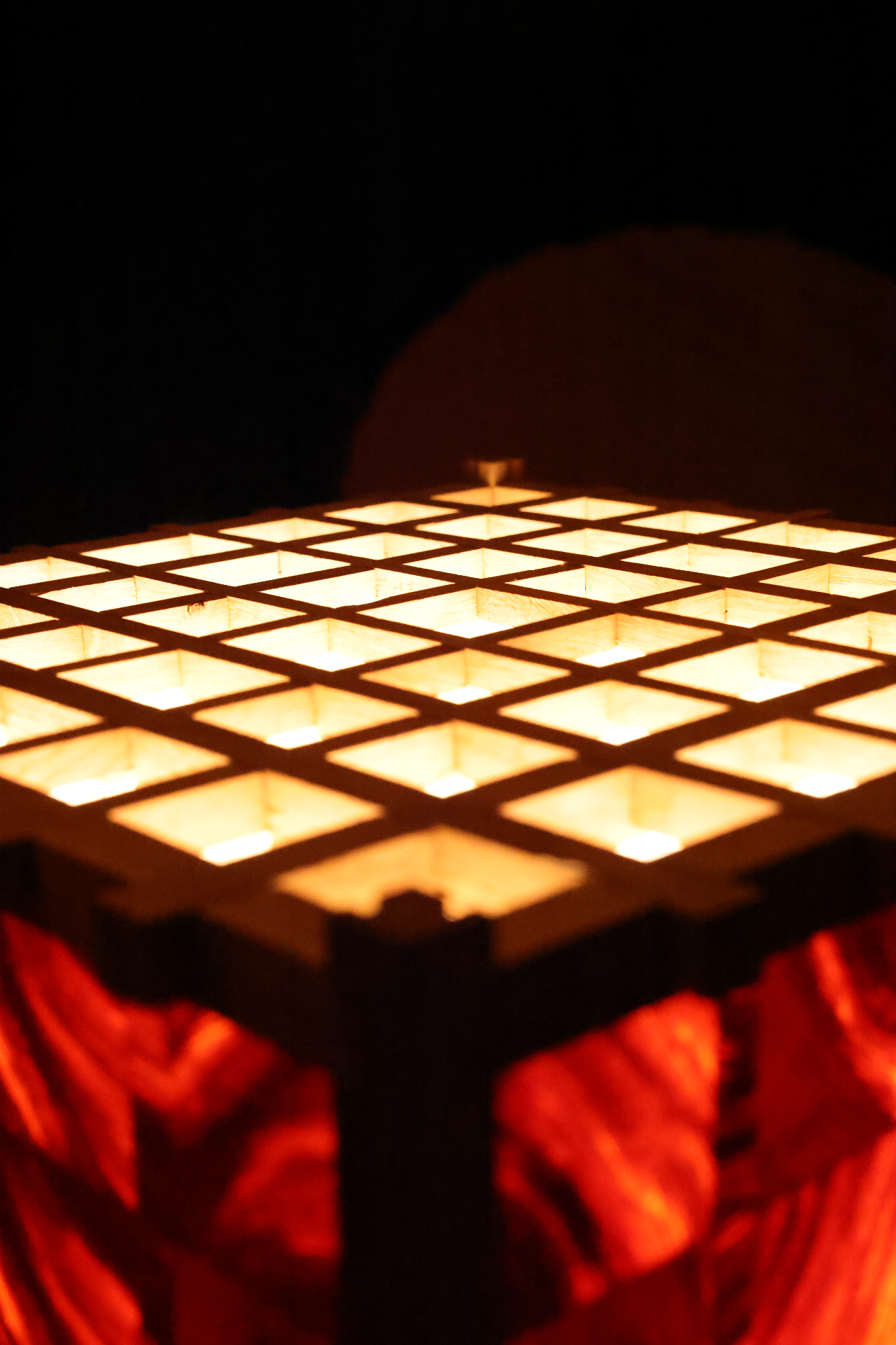 PASSAGE viewed upward through its illuminated square lattice