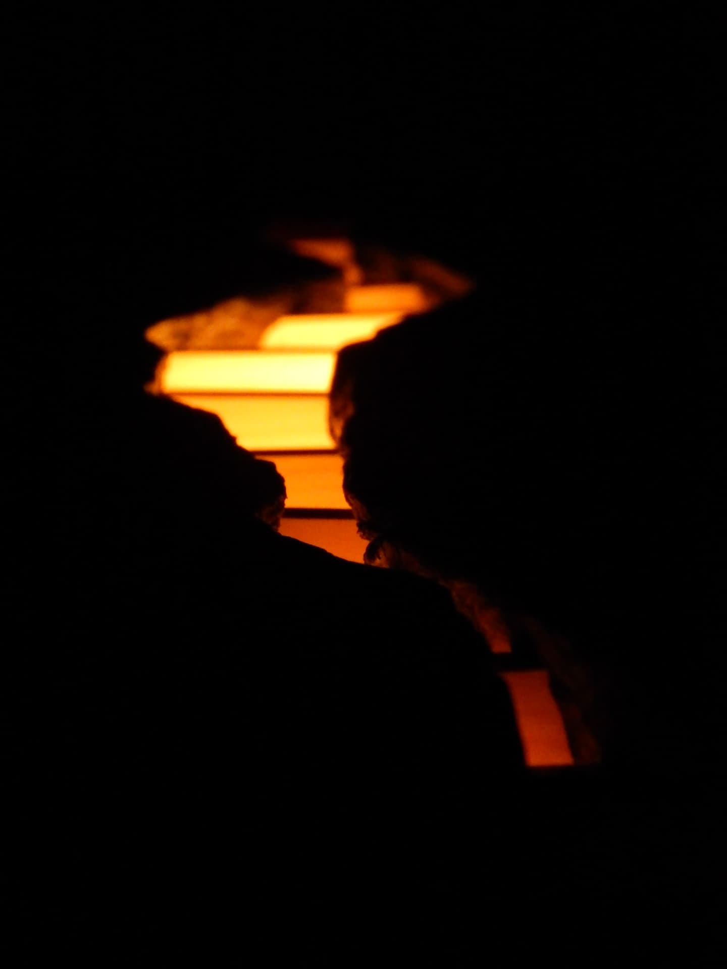 RIFT detail — light escaping through the cracks of the wooden structure in darkness
